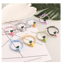 Detailed set of 8 colorful hair scrunchies with cute carrot charms and bows decoration