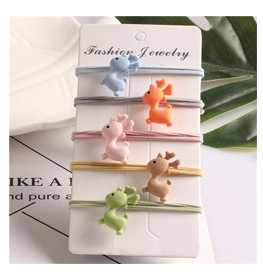 Detailed view of colorful elastic hair scrunchies set with cute cartoon deer resin charms