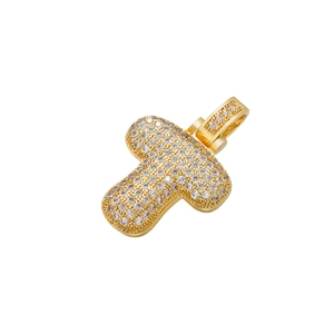 Close-up of golden letter F pendant paved with clear crystals in hip hop style