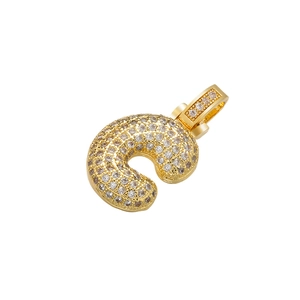Close-up of golden letter J pendant with micro-pave sparkling cubic zirconia stones