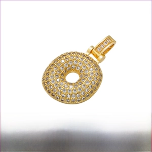 Detail view of gold hip hop pendant with cubic zirconia and brass material dimensions
