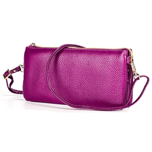 Detail view of purple lychee pattern leather handbag with light gold metal zipper and hardware