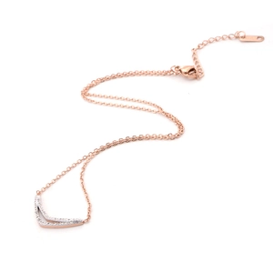 Detail of rose gold V-shaped pendant necklace with rhinestones and lobster clasp