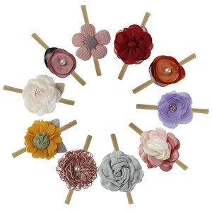 Detail of 10-piece baby floral headbands set featuring handmade lace and chiffon flowers