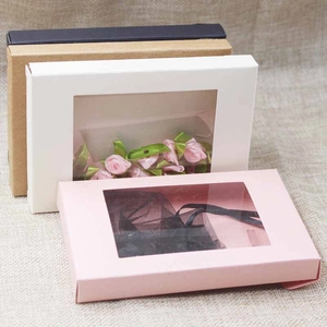 Detail of kraft gift boxes with PVC windows in white, pink, brown, and black colors