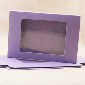 Detailed view of foldable purple paper gift box featuring a clear PVC window panel