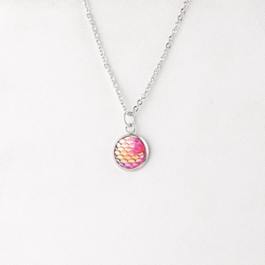 Detail of 12mm silver stainless steel necklace with pink iridescent fish scale pendant