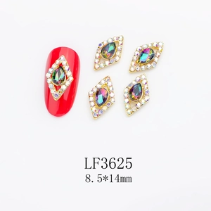 Macro view of red diamond shape nail art charms with aurora rhinestones and 8.5x14mm size