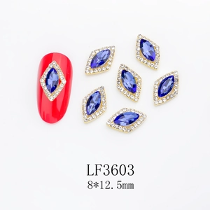Macro detail of LF3603 rhonbus nail crystal with blue stone and gold base 8x12.5mm