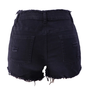 Detail view of high waist frayed black denim shorts with dual back pockets and distressed edges