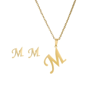 Detail view of a gold-plated letter M pendant necklace and matching stud earrings set
