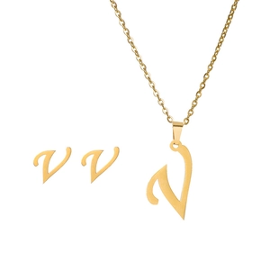 Detailed view of gold stainless steel necklace and earrings set featuring letter V pendant