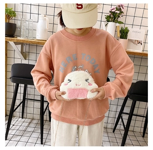 Detail of cute rice ball plush bag featuring embroidered facial expressions and chain strap