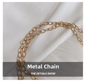 Detailed macro view of the premium gold metal chain strap on a plush crossbody bag