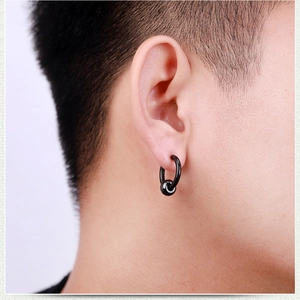 Minimalist black stainless steel ball closure ring earring worn on earlobe for men