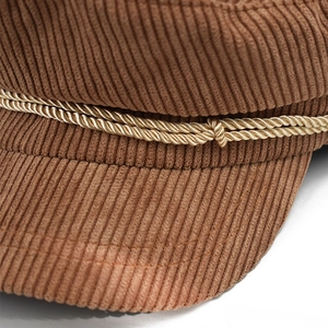 Brown corduroy octagonal newsboy hat with gold braided rope detail and retro style