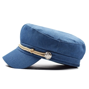 Blue corduroy newsboy cap with gold braided rope detail and side metallic buttons