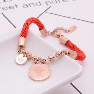 Red braided rope bracelet with rose gold Elizabeth II coin pendant and crown charm