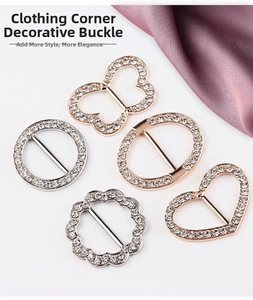Macro detail of rhinestone-studded alloy T-shirt knot clips in silver and rose gold finishes