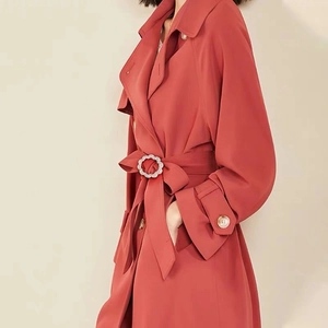 Elegant red trench coat with adjustable waist belt and metal ring buckle for women