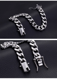 Detail of silver Cuban link bracelet with iced out CZ zircon clasp on leather