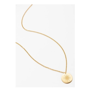 Detailed close-up of golden sunburst coin pendant with embossed evil eye motif on thin chain