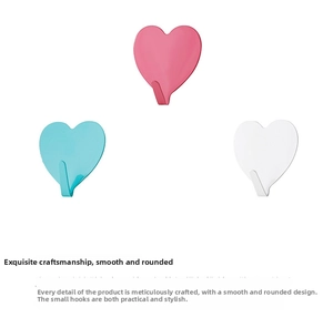 Detail of colorful heart-shaped hooks showing smooth surface in pink, teal and white