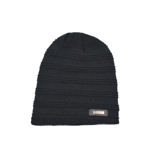 Unisex black knit beanie with fleece lining and metal fashion logo for winter outdoor warmth