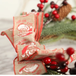 Horshoe Christmas wreath with red berries, bells and Santa Claus ribbon decoration