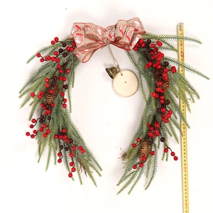 Detail view of 50cm rustic Christmas pine wreath with red berries and measuring tape