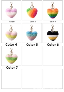 Detail view of seven colorful heart-shaped plush keychains with gold metal rings