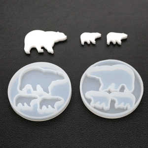 Detailed polar bear silicone mold for resin casting with finished white resin bears
