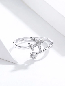 Macro shot of S925 sterling silver open ring with airplane and star zircon pavé detail