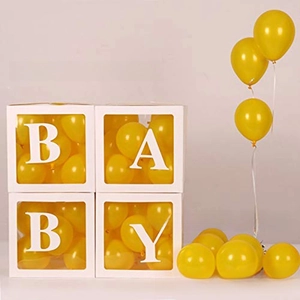 Close-up of four transparent baby shower boxes with white borders and yellow balloons