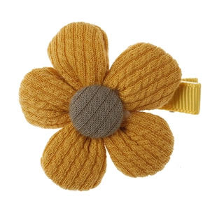 Cute yellow knitted flower hair clip for girls with a gold ribbon wrapped metal clip
