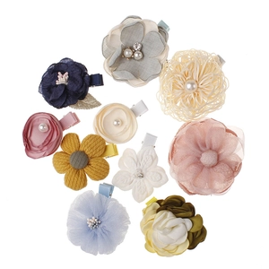 10-piece set of colorful fabric flower hair clips for girls including roses and daisies