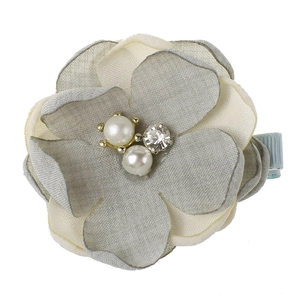 Detailed view of handmade fabric flower hair clip with pearls and rhinestones