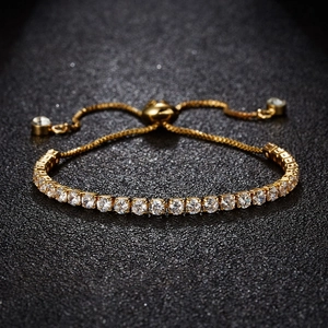 Macro detail of adjustable gold tennis bracelet with shimmering 3mm zircon stones