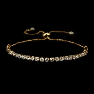 Detailed macro view of 3mm gold tennis bracelet with cubic zirconia and adjustable slide clasp