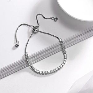 Detail of a 3mm silver tennis bracelet with cubic zirconia and adjustable slider clasp
