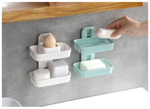 Close-up of double-layer wheat straw soap holder with hollow drainage on tiled wall