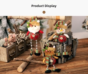 Close-up of Christmas trio ornaments with plaid patterns and beaded legs on wood surface