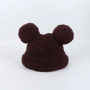 Detail of dark brown plush teddy fleece kids hat with cute round Mickey ears