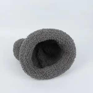 Detailed close-up of the plush gray lamb wool texture on a cozy winter children beanie