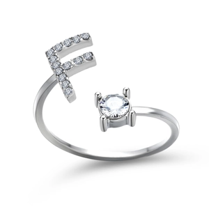 Detailed shot of silver adjustable F letter ring with sparkling cubic zirconia setting