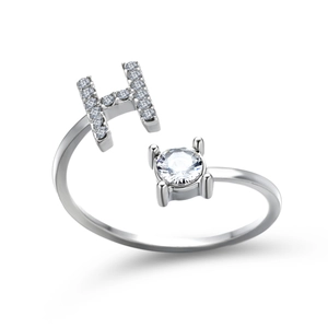 Detailed view of silver adjustable ring featuring a pavé-set letter H and round cubic zirconia