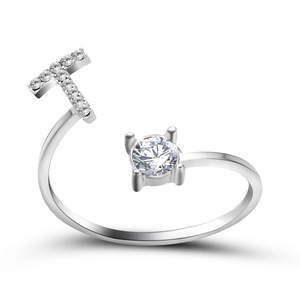 Detail of adjustable silver ring with letter T design and sparkling rhinestone inlay
