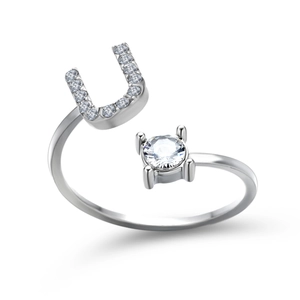 Detail of adjustable silver ring with letter U charm and sparkling zircon stone