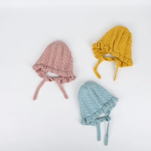 Three-piece baby knit hats set with earflaps and cable knit texture in pastel colors