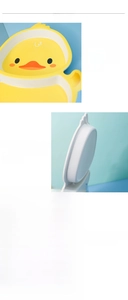 Detail view of yellow duck-shaped melamine divided plate for baby food and meals